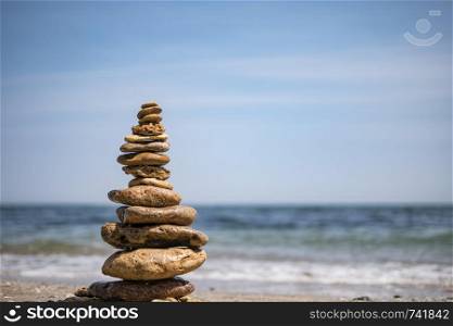 cairn on sea background. pyramid