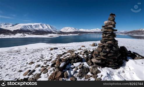 cairn snow lake winter rocks pile