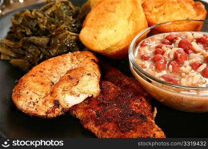 Cajun flavored catfish and chicken with red beans, turnip greens and jalepeno cornbread.