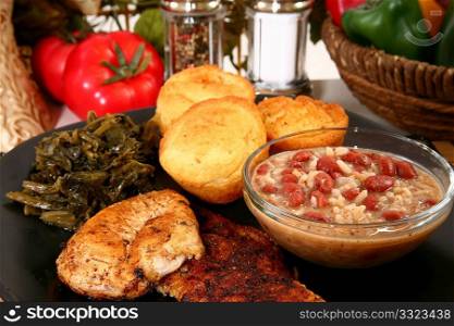 Cajun flavored catfish and chicken with red beans, turnip greens and jalepeno cornbread.