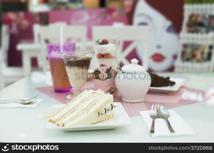 Cake and a milkshake in confectionery.