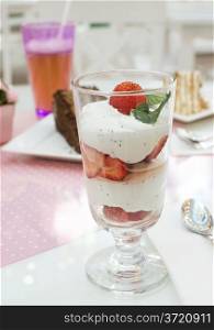 Cake and strawberry smoothie in confectionery.