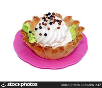 Cake basket with white cream decorated with small balls
