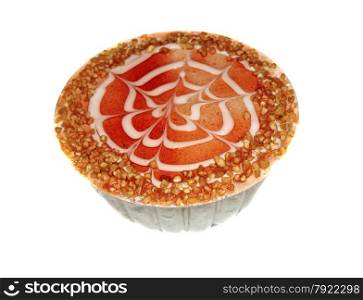 Cake decorated with red berry jelly and crushed nuts isolated