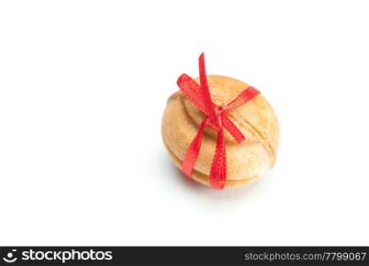 cake nut and ribbon isolated on white