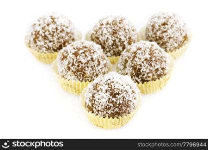 cake topped with coconut flakes isolated on white