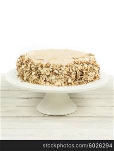 Cake with almonds and nougat creme on a wooden table