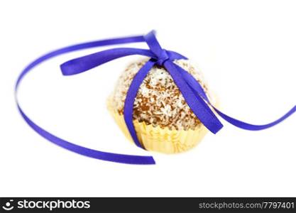 cake with coconut tied with ribbon isolated on white