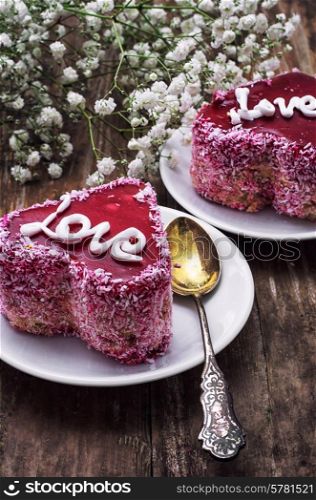 cake with fruit filling in the shape of heart with the inscription love
