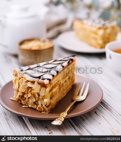 Cake with peanuts, walnuts, chocolate and caramel cream