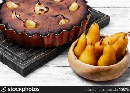 Cake with pear. Baked sweet cake with whole pears in baking dish