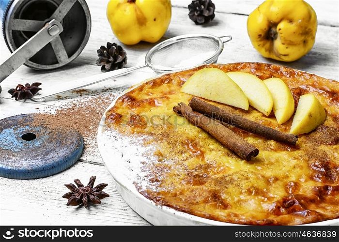 cake with quince and cooking utensils