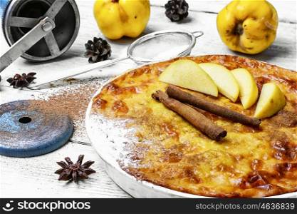 cake with quince and cooking utensils