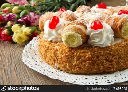 cake with whipped cream and cream puffs
