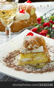 cake with whipped cream and cream puffs