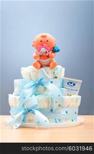 Cakes made of diapers on white