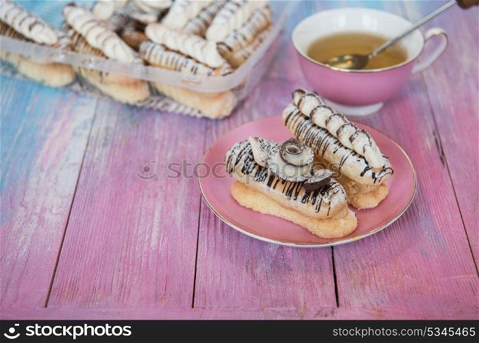 cakes on color background. Cakes with tea on gradient color background