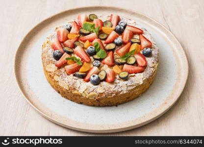 cakes with fruit and berries. Sweet bright cakes with fruit and berries