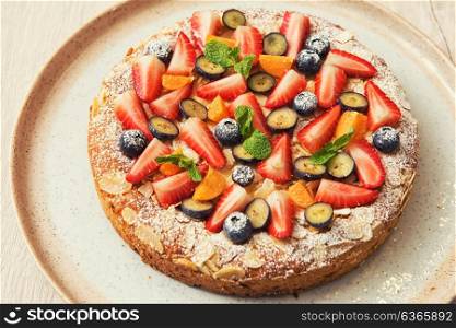 cakes with fruit and berries. Sweet fresh cakes with fruit and berries