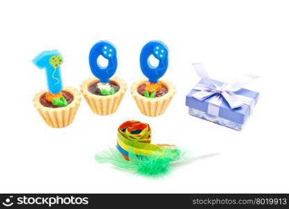 cakes with one hundred years birthday candles, whistle and gift on white background