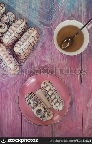 Cakes with tea on gradient color background. cakes on color background