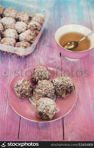 Cakes with tea on gradient color background. cakes on color background