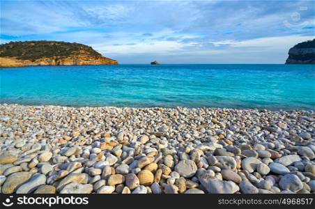 Cala Barraca beach in Xabia Javea rolling stones of Alicante Spain