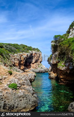 Cala de Rafalet cove in sunny day, Menorca island, Spain