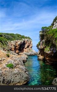 Cala de Rafalet cove in sunny day, Menorca island, Spain