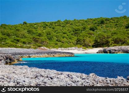 Cala des Talaier wild beach in sunny day at Menorca island, Spain.
