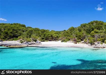 Cala Turqueta beach in sunny day, Menorca island, Spain.