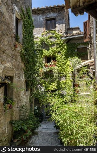 Calcata, Rome, Lazio, Italy: typical alley of the medieval village