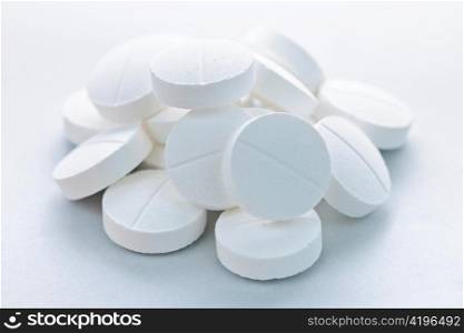 Calcium supplement pills in a pile closeup