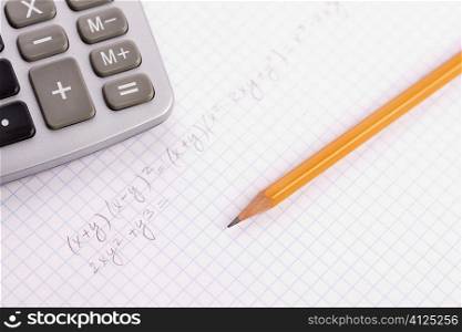 calculation concept with pencil and notebook, focus on center of photo