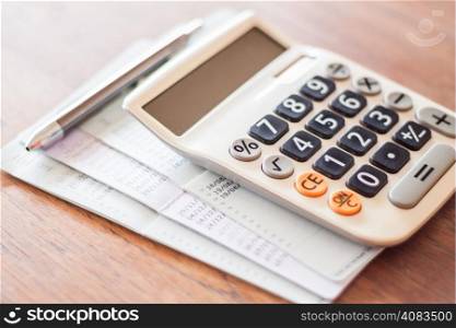 Calculator and pen with bank account passbook, stock photo