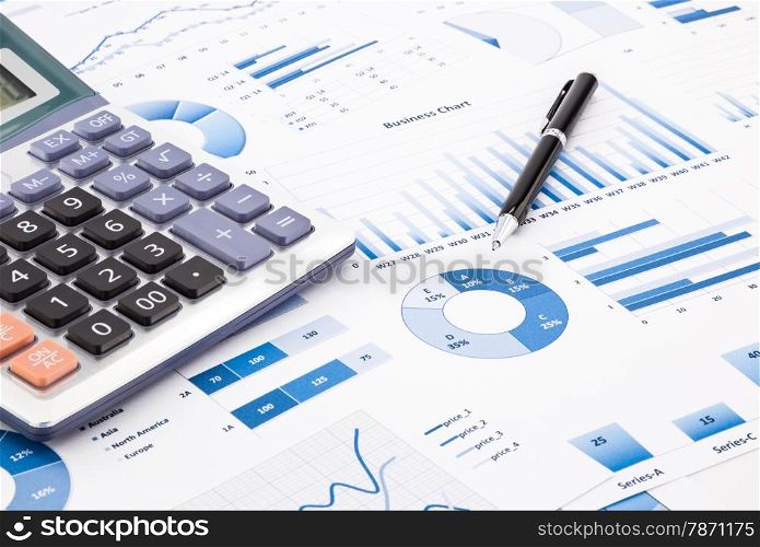 calculator and pen with blue business charts, graphs, infomation and reports background for financial and business concepts