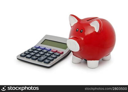 Calculator and piggy bank on white