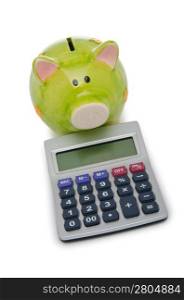 Calculator and piggy bank on white