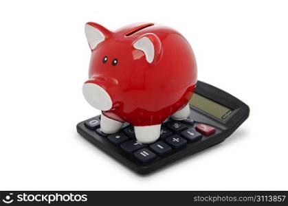 Calculator and piggy bank on white