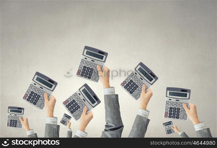 Calculator in hands. Many hands of business people holding calculators