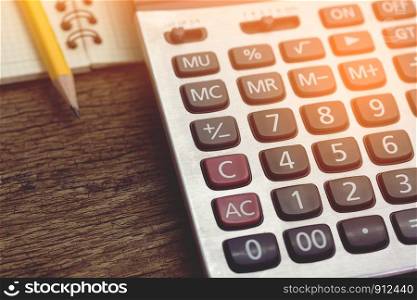 calculator on wood table.