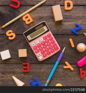 calculator stationery amidst letters geometric figures
