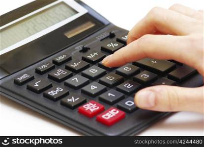 calculator with hand isolated on white