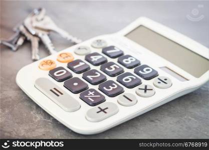 Calculator with keys on grey background, stock photo