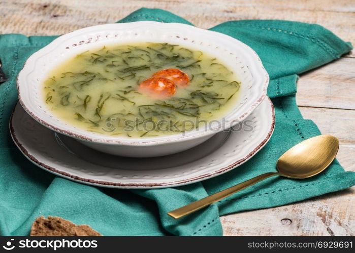 Caldo verde popular soup in Portuguese cuisine. traditional ingredients for caldo verde are potatoes, collard greens , olive oil and salt. Additionally garlic or onion may be added.