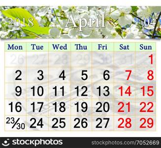 calendar for April 2018 with blooming cherry tree. calendar for April 2018 with white blooming cherry tree