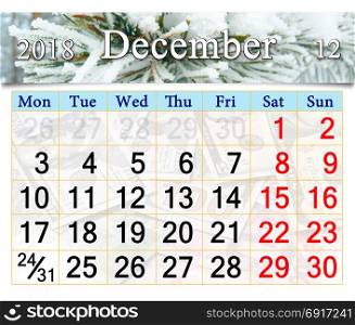 calendar for December 2018 with branch covered by hoar-frost. calendar for December 2018 with picture of white branch covered by hoar-frost