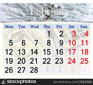 calendar for February 2018 with snowy pine branches. calendar for February 2018 with snowy pine branches in the forest