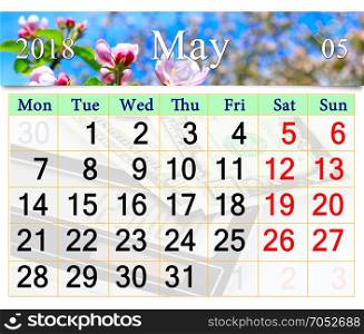 calendar for May 2018 with blooming buds of apple tree. calendar for May 2018 with pink buds of blooming apple tree