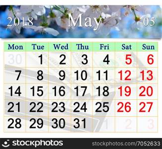 calendar for May 2018 with blooming cherry tree. calendar for May 2018 with white blooming cherry tree
